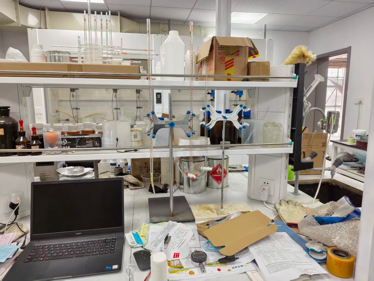 Laboratory bench with glassware and sample containers