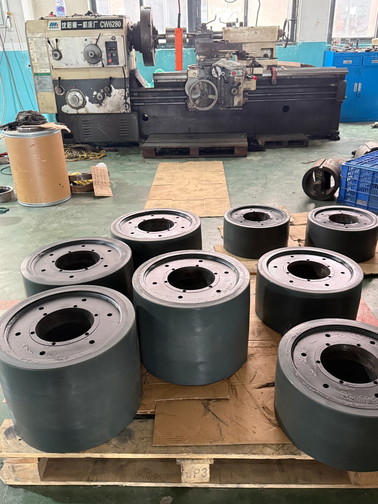 Workshop lathe with a batch of large finished wheels